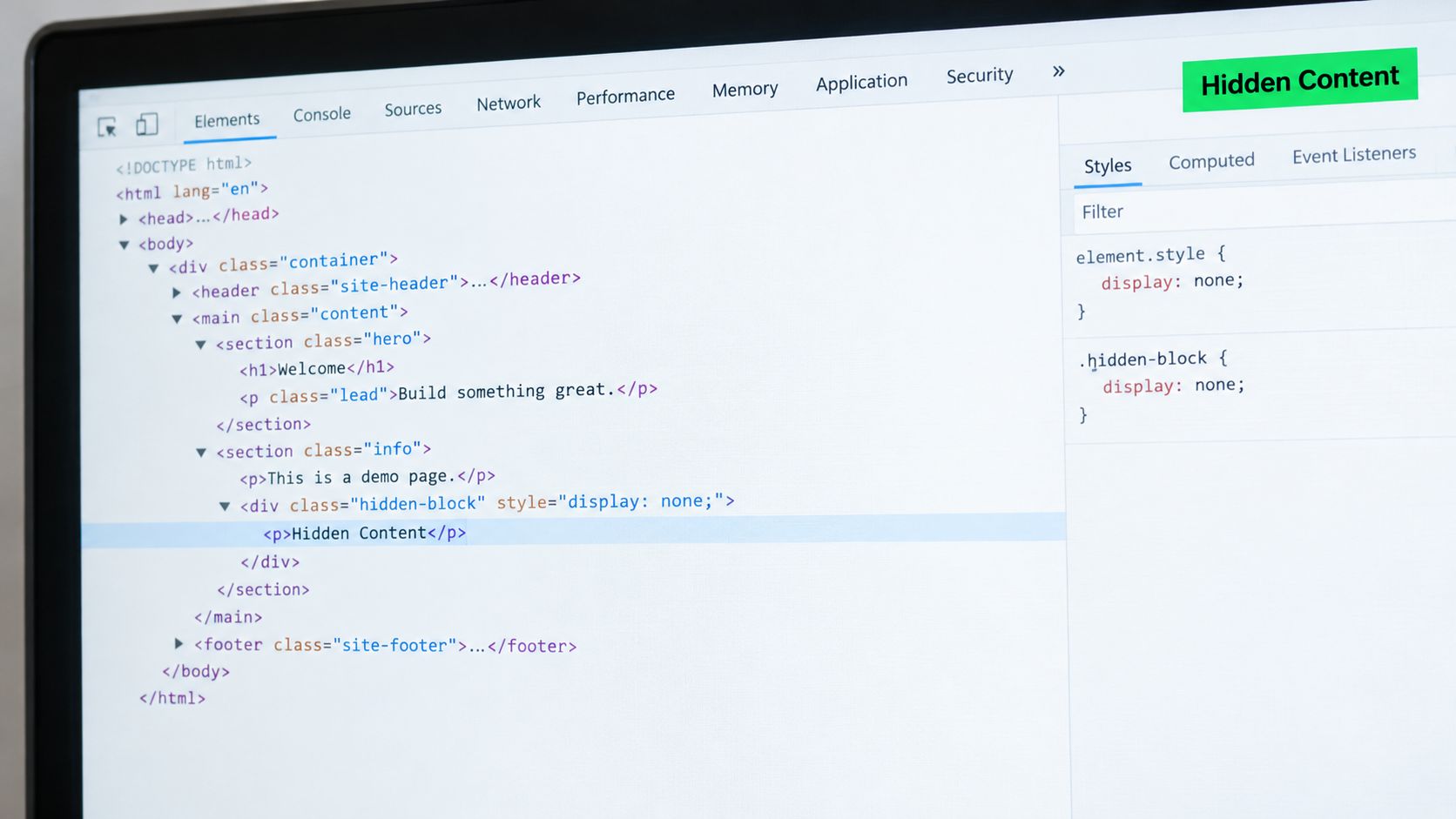 A close-up view of a browser developer tools window inspecting hidden HTML website content on a monitor.